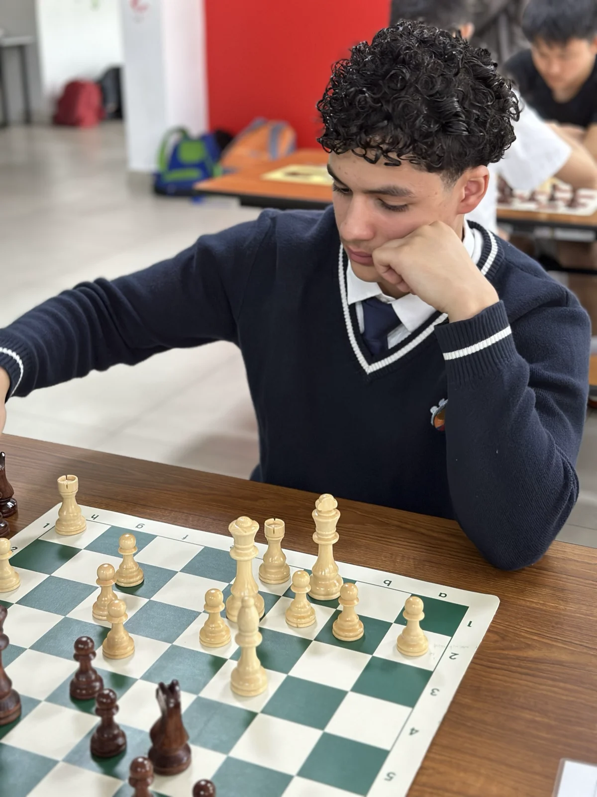 Mahmod Hammouda mid-game at a school chess tournament